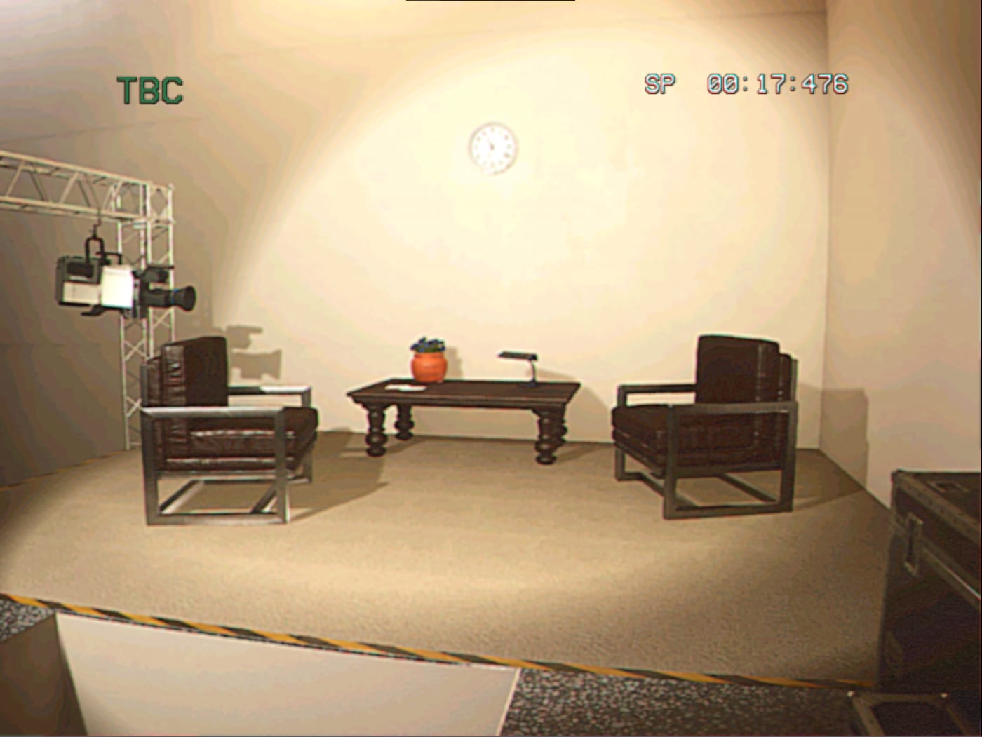A period television studio set seen through the camcorder